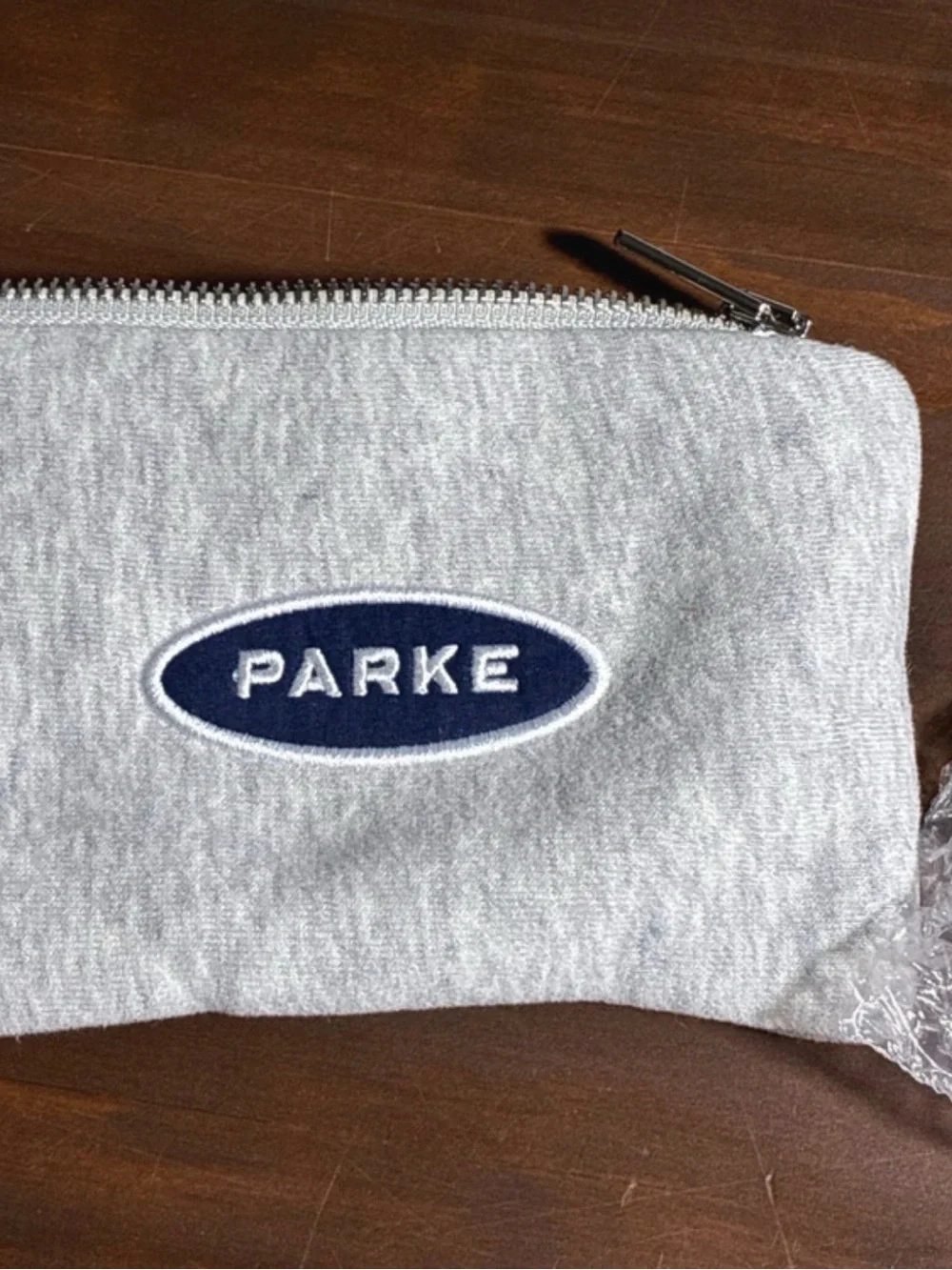 PARKE Orange Hair Claw Clip with Gray Logo Pouch